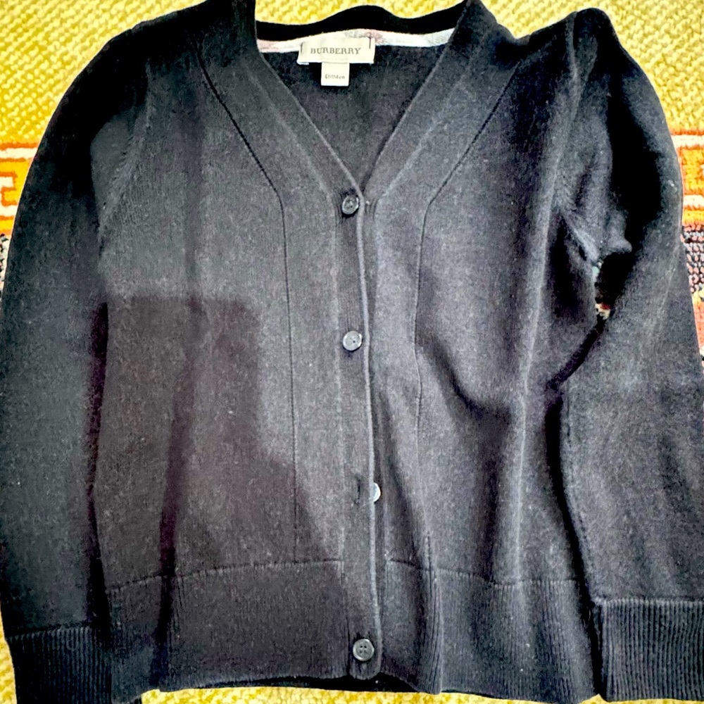 Burberry Black kids button shirt, it was size 6 by when i washed it got smaller